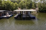 THE DOCK WITH PWC LIFT FOR 2 PWC`S IN ONE OF THE BOAT SLIPS AND A BOAT LIFT/HOIST IN THE SECOND SLIP